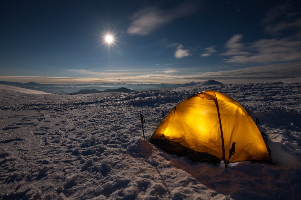 Camping during winter hiking in Carpathian mountains