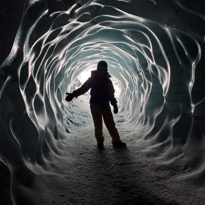Person in an Ice tunnel in Iceland - Viking Travel