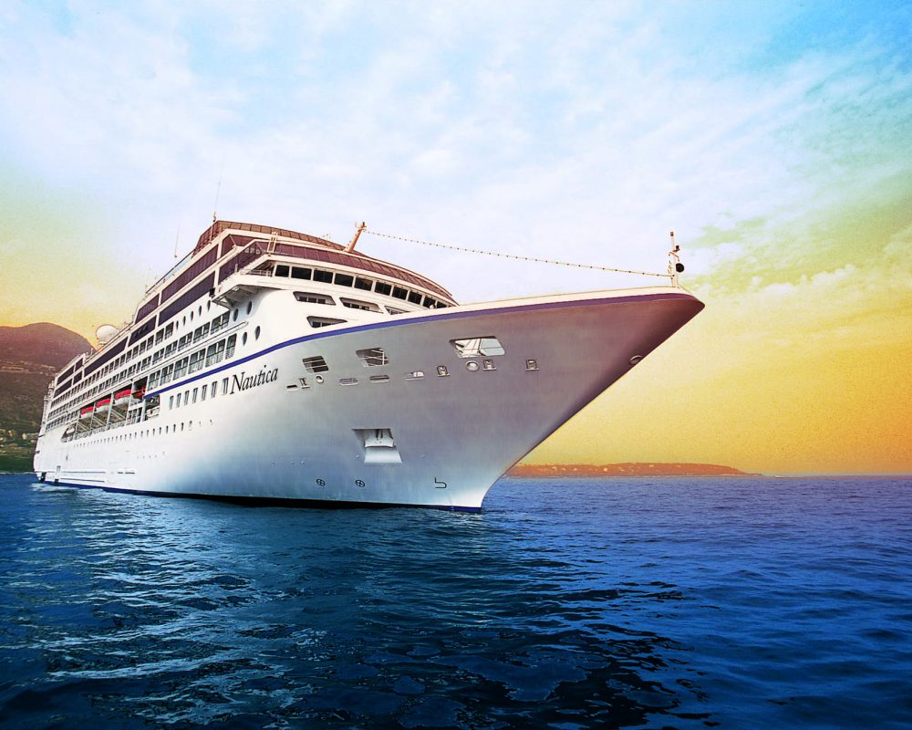 Oceania cruise ship Nautica 2 sailing in blue waters - Viking Travel