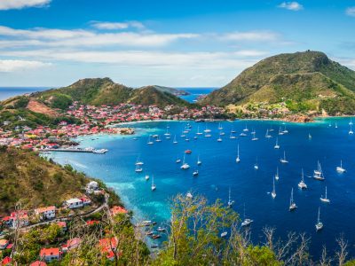 Colorful image of Guadeloupe Terre de Haut bay and town with buildings along the coastline - Viking Travel