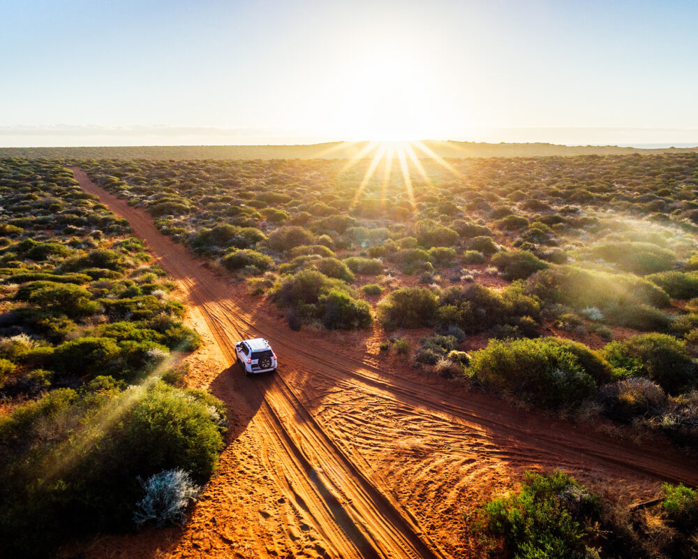 Driving off-road in Western Australia at sunset - Viking Travel