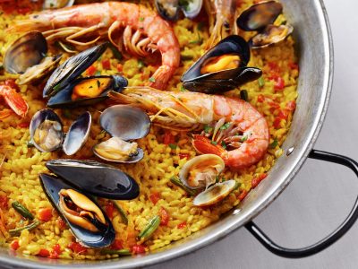 Typical Spanish seafood paella in traditional pan - Viking Travel
