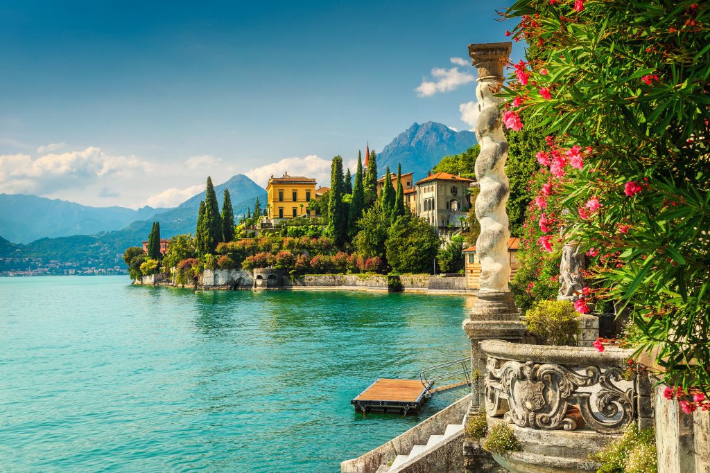 Oleander flowers and villa Monastero in background, lake Como, Varenna - Viking Travel
