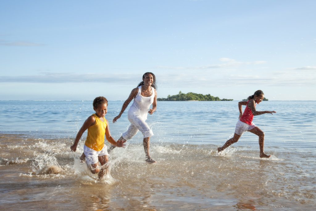 Fijian Mother and Daughters Running on Beach - Viking Travel